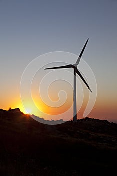 High constrast sillouette of a wind turbine photo