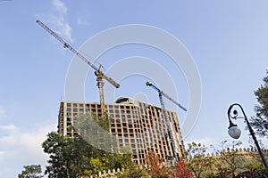 High construction cranes at a construction site