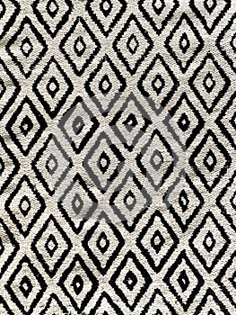 High contrast diamond pattern black and white throw rug