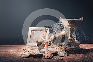 High contrast image of dusty trophies with cobwebs representing