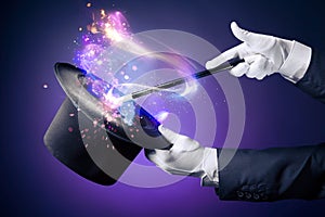 High contrast image of magician hand with magic wand