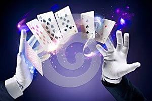 High contrast image of magician making card tricks