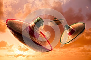 High contrast image of Mexican hats / sombreros in the sky photo