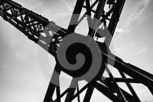 High contrast photo reveiling the metal structure cross on the eiffel tower.