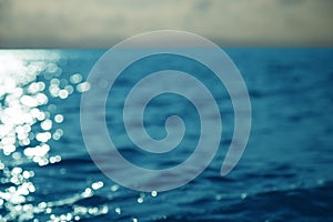 High contrast sea or ocean surface at sunset background