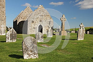 High Cross and temple. Clonmacnoise. Ireland photo