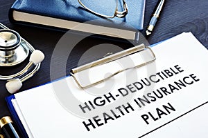 High-deductible health insurance plan HDHP on a desk. photo