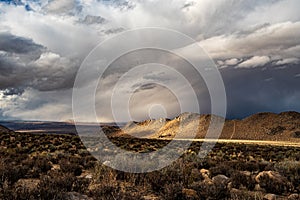 High desert landscape to distant hills with OHV dirt track photo