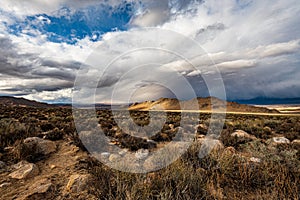 High desert landscape to distant hills with OHV dirt track photo