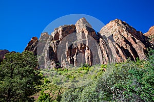 High dramatic mountain structures seen on each side of Mt. Carmel highway in Zion