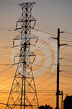 High electric pylon at sunset
