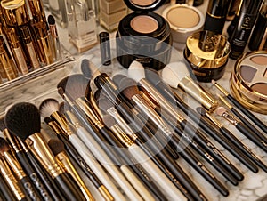 High-end makeup brushes and cosmetics arranged in a luxurious setting