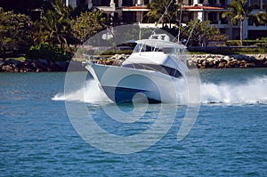 High-end sport fishing boat headed towards the open ocean