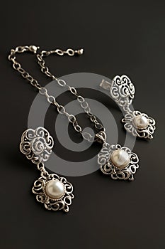 High-end vintage jewelry with pearls on dark background