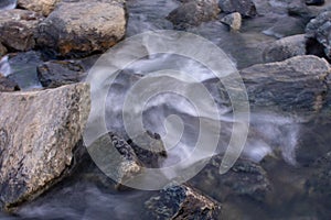High exposure image of water flowing down between the rocks