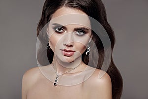 High Fashion brunette model woman in diamond jewellery set isol