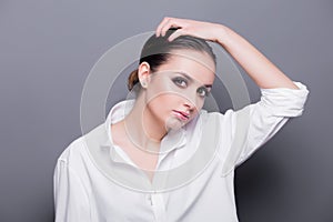 High fashion look glamor portrait of beautiful sexy stylish Caucasian young woman model in a white shirt. Professional Make up for