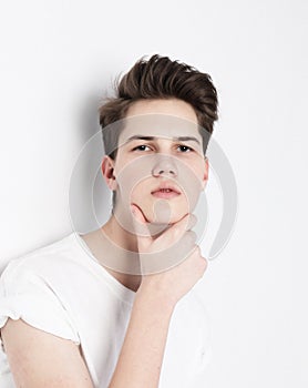 High Fashion model man portrait isolated on grey background.