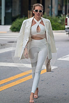 High fashion model walking on street. Woman fashion style. Fashion beautiful elegant woman. Beautiful woman wearing