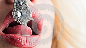 High fashion portrait of beauty model girl with a big diamond. Luxury make-up and accessories, white smooth shiny hair