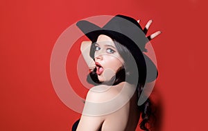 High-fashion portrait. Sexy sensual elegant woman in black hat. Trendy Retro fashion. Isolated.