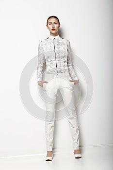 High Fashion. Trendy Woman in White Breeches in Graceful Pose. Spring Time Collection