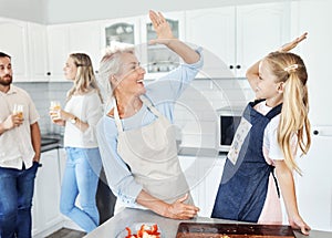 High five, kitchen and cooking family or grandmother and child for success, learning achievement or home food health