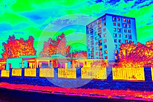 High flat house behind family house in Infrared thermovision scan