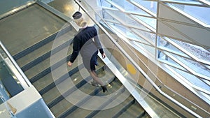 High flight attendant, shod in high heels, climbs up the ladder.