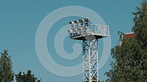 High floodlight in the stadium in the summer daytime