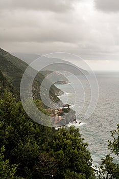 High forested mountains and stormy sea