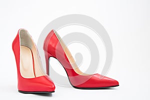 High-heeled shoes in red. Sexy shoes. White background. There is space for text