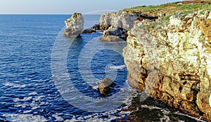 High inaccessible coastal cliffs made of shell rock near the village of Tyulenovo, southern Bulgaria