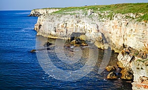 High inaccessible coastal cliffs made of shell rock near the village of Tyulenovo, southern Bulgaria