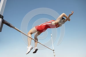 High Jumper In Midair Over Bar photo