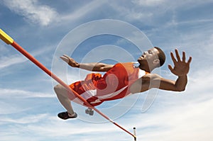 High Jumper In Midair Over Bar photo