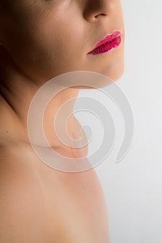 High key fine art portrait of woman mouth and chin on bright white background