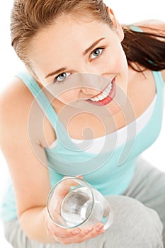 High key Portrait of attractive young woman drinking water isolated on white background