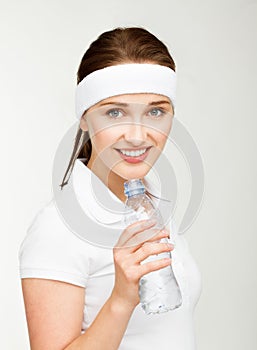 High key Portrait of attractive young woman drinking water isolated on white background