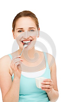 High key Portrait young caucasian woman eating yogurt isolated