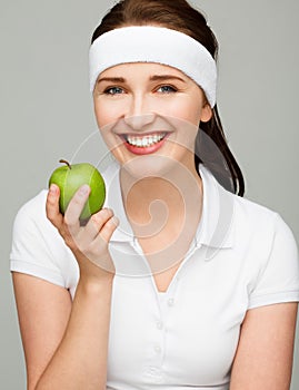 High key Portrait young woman holding green apple isolated on white background