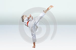 High kick leg is beating the girl with a red belt