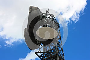 High large antennas transmitting signals with current satellite dishes and high intensity electrical cables