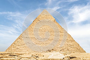 high largest pyramid of Chephren on the background of a blue sky with clouds, Giza, Cairo, Egypt. second pyramid. Pyramid of