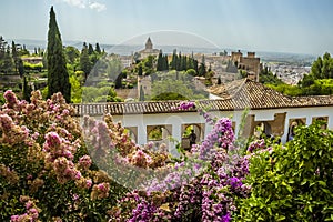 A high-level view over the Alhambra district with the city of Granada in the distance