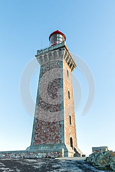 High lighthouse on a rock located on a French island.