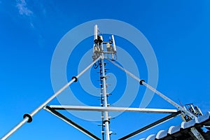 High mast metal structure telecommunication on tower with blue s