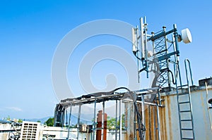 High mast metal structure telecommunication on tower with blue sky.