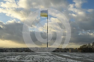 High mast with a State Flag Of Ukraine with background of the evening sky