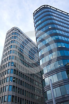 High modern office buildings in a city over blue s